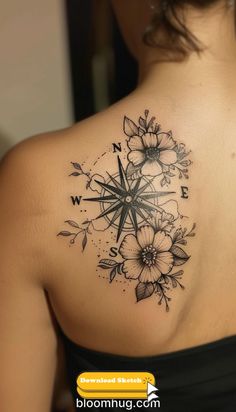 a woman with a compass tattoo on her back shoulder and flowers around the neck,