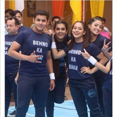 the young people are posing for a photo with their hands in the air while wearing matching t - shirts that read behno ka