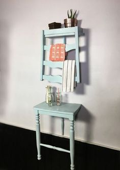 a small blue table with towels on it