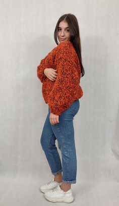 "OVERSIZE Handmade wool cardigan, warm woolen sweater. OVERSIZE warm, handmade, beautiful orange cardigan made of wool and mohair. The sweater has a universal shape and is carefully finished with a drawstring. The sweater is fastened with a safety pin, so you can adjust it accordingly. Sweater dimensions measured flat; width 58 cm length 53 cm The model in the photo is 165 cm tall and wears size M. The cardigan fits women wearing sizes 38 to 42. Design and workmanship by HERMINA  Composition: 50% wool 50% mohair  We recommend hand washing in lukewarm water with a mild liquid. Dry flat in the unfolded position. From time to time, the sweater can be \"bathed\" in cool water with hair conditioner to smooth the fibers and obtain a soft effect. After such treatment, dry as above. Please remembe Hand Knitted V-neck Sweater For Fall, Orange Soft Knit Long Sleeve Sweater, Orange Long Sleeve Soft Knit Sweater, Burnt Orange Long Sleeve Winter Sweater, Orange Chunky Knit Sweater For Fall, Orange V-neck Knit Sweater, Orange Knitted Long Sleeve Outerwear, Casual Orange Acrylic Sweater, Oversized Orange Winter Cardigan