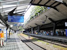 people are waiting for the train to arrive