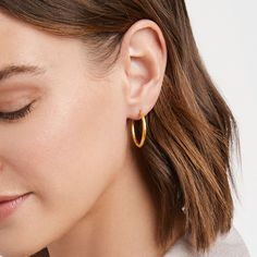 Lightly hammered shimmering 2-in-1 earring that can be worn as a single or double hoop. 2 inch length 24K gold plate Julie Vos hallmark Willow Tree Wedding, Julie Vos, Gold Dangle Earrings, Bow Jewelry, Fragrance Wax, Fine Linens, Gold Earrings Dangle, Novelty Gifts, Elegant Gift