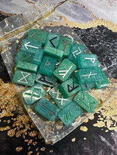 green dices sitting on top of a glass plate