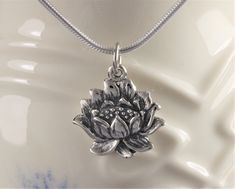 Sterling Silver Lotus Flower Necklace. A symbol of purity and enlightenment, the lotus begins life underwater, working diligently to grow strong and greet the sunlight as one of nature's most beautiful blossoms. This lovely pendant comes with a very high quality, Italian-made, sterling silver snake or bead chain. Spiritual Lotus Flower Necklace For Meditation, Spiritual Lotus Flower Necklace Gift, Spiritual Lotus Flower Necklaces For Gifts, Spiritual Lotus Flower Jewelry For Meditation, Spiritual Goddess, Life Underwater, Lotus Flower Necklace, Lotus Necklace, Lotus Pendant