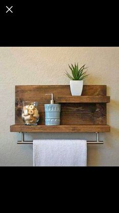 a bathroom shelf with a potted plant on it