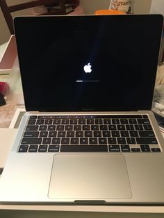 an open laptop computer sitting on top of a table