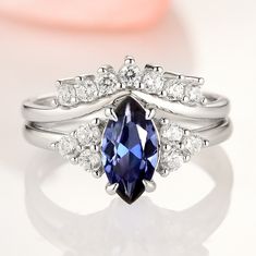 Gorgeous Vintage Inspired Marquise Royal Blue Sapphire Ring. Can be purchased with or without stacking band/wedding band. Select desired style option from the drop-down menu. ►Made of solid 925 sterling silver with rhodium finish ►Average band width: 1.6 mm (each ring)Center Stone: SapphireColor: Royal BlueShape: Marqu Royal Blue Sapphire Ring, Sapphire Engagement Rings, Popular Engagement Rings, Blue Sapphire Ring, Sapphire Color, Creating Jewelry, Wedding Ring Designs, Bridal Ring Set, Blue Sapphire Rings