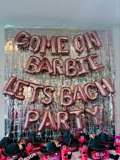 some balloons that say come on, barbeque let's back party and hats