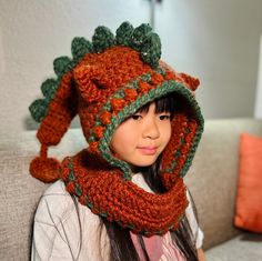 This is a fun dinosaur hat with two adorable ears,for children aged 5 and up to adults. Crochet Dinosaur Hat Pattern, Cute Winter Crochet Hat In Acrylic, Cute Acrylic Crochet Hat For Winter, Fun Crochet Hat For Winter, Cute Adjustable Crochet Winter Hat, Cute Hand Knitted Winter Bonnet, Cute Adjustable Crochet Hat For Winter, Playful Handmade Crochet Hat For Winter, Handmade Playful Winter Bonnet