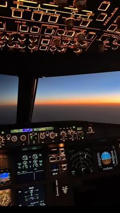 the view from inside an airplane at sunset