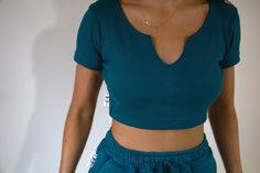 Teal Blue ribbed crop top with short sleeve, stretchy, handmade in England, matching shorts available model size 8 wearing size 8 Fitted V-neck Cropped T-shirt For Summer, Stretch Ribbed Crop Top With Short Sleeves, Summer Ribbed Crop Top With Short Sleeves, Fitted Cropped T-shirt With Short Sleeves For Loungewear, Stretch V-neck Cropped T-shirt For Summer, Sporty Ribbed Short Sleeve Crop Top, Trendy Fitted Short Crop Top, Blue Fitted Cropped T-shirt, Blue Ribbed Sporty Crop Top