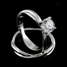 a white gold ring with a diamond on it