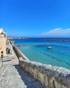 the water is crystal blue and there are steps leading up to it