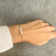 A real pearl bracelet with genuine pearls and 925 sterling silver. If you are looking for Christmas Gifts or bridesmaid gifts this pearl boho bracelet is a great idea. You will love to wear it every day! This dainty boho bracelet adds a sparkling shine to your look!  Ideal for a wedding day as wedding jewelry!❤️️❤️️ 👉Handmade with love in Greece! Material  ✔️Pearl original gemstone ✔️Gold-filled  925 sterling silver      >>IS IT A GIFT?❤️️ This dainty bracelet comes in a beautiful gift box. If Pearl White Oyster Bracelet As A Gift, Pearl Drop Bracelet As Gift, Adjustable Pearl Drop Bracelet As Gift, Adjustable Pearl Drop Bracelet For Gift, Pearl White Bracelets With Pearl Drop As Gift, Pearl White Bracelet With Pearl Drop As Gift, Delicate Beaded Oyster Bracelets For Gift, Adjustable Pearl Bracelet For Anniversary, Adjustable Pearl Chain Bracelet For Anniversary