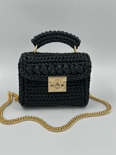 ELEGANT HIGH QUALITY BAGS 🛍️🛍️🛍️       Product Description:  ✨It is handcrafted with love using high-quality metallic yarn, giving it a unique and luxurious look. The black metallic color adds a touch of elegance and sophistication, making it perfect for both day and night occasions. ✨ The lining is carefully chosen to match the bag's color, adding a seamless finish to the overall design. ✨ It sits comfortably on your shoulder and adds a touch of glamour to any outfit. Whether you're heading Elegant Handmade Black Bag, Luxury Handmade Crochet Bag As Gift, Handwoven Black Shoulder Bag As Gift, Luxury Handmade Crochet Bag For Gift, Handwoven Black Shoulder Bag Gift, Elegant Black Crochet Tote Bag, Handwoven Black Shoulder Bag For Gift, Luxury Black Crochet Top Handle Bag, Luxury Black Crochet Bag With Top Handle