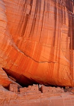 a large rock formation in the middle of a desert