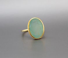 ♦♦ Beautiful handcrafted ring ◘Stone Information: Genuine Aqua Chalcedony- Color: Blue Cut: Oval Size: 13X18 mm ◘ Metal: 925 Sterling Silver ◘ Band: 1.5 mm ◘ Setting: Open back bezel setting ◘ Finish: High polish ◘ Nickel free ◘ Handmade band: 14 gauge solid sterling wire This ring is adorably rustic, easy to wear, & stackable! ◘Please Note - The Ring in the Picture can be available or Sold out. Every Ring is Made of a Unique Gemstone. Therefore, Colors and Inclusions of the Stone may Vary. Silver Ring Stone, Boho Rings Gold, Aqua Chalcedony Ring, Chalcedony Ring, Ringe Gold, Etsy Gold Ring, Aqua Chalcedony, March Birthstone, Ring Stone