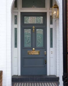 a blue front door with two sidelights