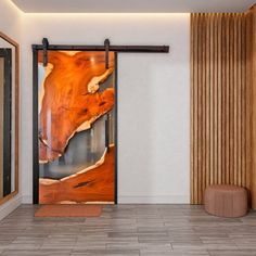 an open door with a painting on it in front of a wooden wall and floor