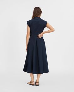 Designed in a cotton poplin, the Midi Shivon Dress is a standout silhouette this season. 
Featuring a wrap silhouette with a pleated underlay skirt and side tie, Midi Shivon is a versatile everyday dress with attention to detail throughout. 
This Summer, style the Midi Shivon Dress back to an everyday flat or simple heel for a polished day-to-night look. Everyday Flats, Everyday Dress, Dress Back, Knitted Coat, Everyday Dresses, Night Looks, Dress Backs, Mommy And Me, Kids' Dresses