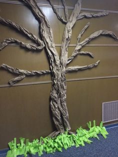 a tree made out of paper on the wall