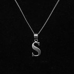 Personalised Initial Necklace made out of pure UK Sterling Silver, hallmarked and soldered throughout for your security.  These really are beautiful quality, a smooth shiny silver letter suspended on a strong bale and curb chain, these will last yourself or your loved one for years. IMPORTANT: We have shown a few photos of the style / font to give you a good idea of what to expect. Metal: 925 Sterling Silver, hallmarked Design: Solid Pendant, Initials, Letters, Name. Length: 18 Inch chain Pendant: Approximately 10 - 12 mm in height, the width will vary depending on letter choice. Style: Boho & Hippie, Minimalistic. Good to Know: Non-tarnish, Water Safe and Skin Friendly Custom: We can offer you a variety of different letters, please select from the variation option at checkout.   Custom: W Boho Jewelry Gold, Jewelry Name, Gold Globe, Opal Drop Earrings, Name Pendant, Bridal Earrings Drop, Initial Name, Gold Letter, Silver Chain Style