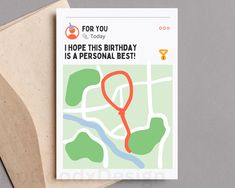 a greeting card with a map and a red marker on it that says for you i hope this birthday is a personal best