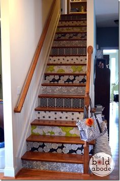 the stairs are decorated with colorful wallpapers