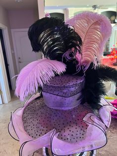 Pink and black trimmed ruffle derby style hat with sparkle polka dots . Handcrafted by designer with giant matching bow, black feather boa, black and pink feathers Feather Trim Costume Hats For Kentucky Derby Races, Feather Trim Mini Hats For Kentucky Derby Evening, Kentucky Derby Evening Mini Hat With Feather Trim, Kentucky Derby Black Feathered Costume Hats, Black Feather Trim Mini Hats For Kentucky Derby, Black Mini Hats With Feather Trim For Kentucky Derby, Fitted Party Hats With Ostrich Feathers, Black Feathered Hats And Headpieces For Kentucky Derby, Black Mini Hat With Feather Trim For Royal Ascot