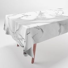 a table with a white marble design on it