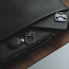 a pair of scissors sitting on top of a black case