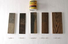 four different types of wood that are being used for wall hangings on the wall