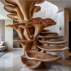 a spiral staircase made out of wood with mushrooms on the top and bottom, in a living room