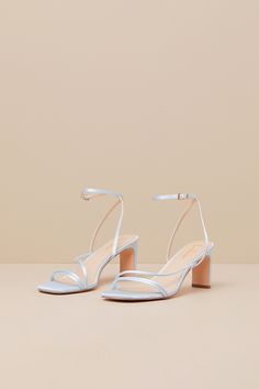 Keep things chic and simple by adding the Lulus Kierha Baby Blue Satin Strappy Low Heel Sandals to any of your effortlessly elegant 'fits! Sleek woven satin shapes these darling heels that feature a square footbed, two slender two straps, and an asymmetrical vamp strap. Matching straps sprout from the sides to cross at the front of the ankle and secure with a gold buckle, all atop a trendy blade heel. 2. 75" wrapped blade heel. Cushioned insole. Felted rubber sole has nonskid markings. Man made Blue Bridal Shoes Low Heel, Dusty Blue Heels Wedding, Satin Sandals With Heel Strap And Open Heel, Satin Sandals With Wrapped Heel And Open Toe, Satin Sandals With Wrapped Heel And Open Heel, Satin Sandals With Wrapped Heel And Open Design, Satin Sandals With Padded Open Heel, Satin Sandals With Wrapped Heel And Open Back, Satin Sandals With Wrapped Heel And Ankle Strap