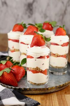 small desserts with strawberries are on a tray