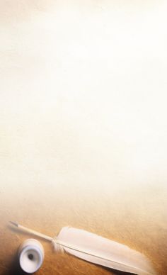 a white feather sitting on top of a wooden table next to a roll of paper