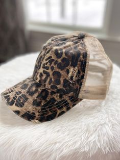 This stylish baseball cap is perfect for anyone who is always on the go! We love the timeless leopard print- it's such a stylish choice for any day. Features an adjustable band and ponytail back! Pair this cap with a graphic tee and leggings and you're ready to go! Trendy Distressed Baseball Cap, Casual Adjustable Leopard Print Hat, Casual Leopard Print Summer Hat, Trendy Leopard Print Cap, Ready To Go, Baseball Cap, Graphic Tee, Leopard Print, Graphic Tees