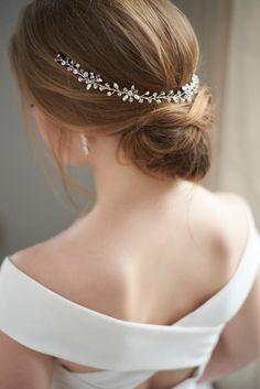 a woman wearing a bridal hair comb