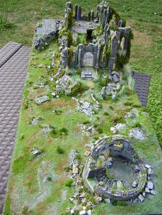 an aerial view of a castle made out of rocks and grass