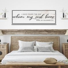 a bedroom with a bed, nightstands and a wall hanging above it that says i have found the one whom my soul loves