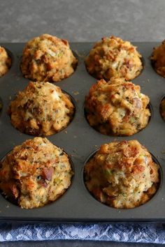 a muffin tin filled with lots of different types of food