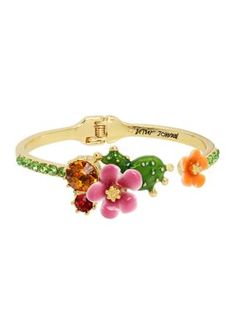 Betsey Johnson's vibrant hinged bangle bracelet featuring colorful tropical flowers, stone gems and delicate green stones at the front. | Betsey Johnson Flower Bangle Bracelet Green Stones, Hinged Bangle, Tropical Flowers, Green Stone, Gold Tone Metal, Bangle Bracelet, Betsey Johnson, Bangle Bracelets, Jewelry Bracelets