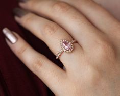 Pear Sapphire Ring, Pear Peach Sapphire Ring | Capucinne Jewelry Pear Sapphire Ring, Engagement Ring Pink, Peach Sapphire Rings, Diamond Sapphire Ring, Peach Sapphire Engagement Ring, Pink Engagement Ring, Peach Sapphire, Buying An Engagement Ring, Ring Halo