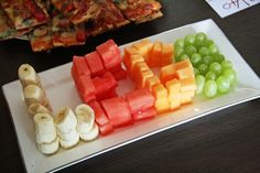 there are many different types of fruit on the plate, including bananas and melon