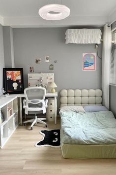 a bedroom with a bed, desk and chair