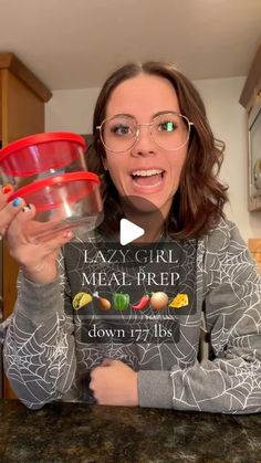 a woman in glasses holding up a bowl with food on it and the words lazy girl, meat prep down 17 / 28