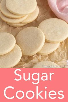 homemade sugar cookies on parchment paper with pink napkin and text overlay that reads, sugar cookies