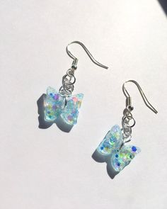 Blue Sparkly Butterfly Earrings Handmade Dainty Dangle Resin - Etsy Whimsical Resin Dangle Earrings, Cute Iridescent Earrings For Gift, Whimsical Nickel-free Resin Earrings, Clear Hypoallergenic Resin Earrings, Hypoallergenic Clear Resin Earrings, Iridescent Dangle Resin Earrings, Cute Blue Resin Earrings, Handmade Clear Resin Earrings, Hypoallergenic Resin Dangle Earrings