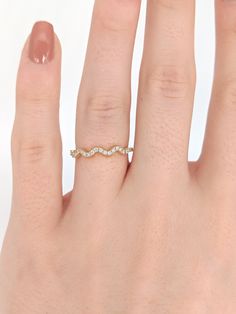 Young & modern Diamond Wedding Band/Stacking Ring with a wavy band. Available in any color 14K Gold. Great accent for stacking, for special occasions, or wedding bands! Available in sizes 4.5-10! Approx Gold Weight: 1.754g 14k Gold Approx Diamond Weight: 0.23cts 25 Diamonds, SI clarity & GH color *Shop Policies:* SHIPPING: All purchases are processed within 1-2 business days. Items that are made to order will be shipped within the projected date shared with you during the purchase. All o Promise Band, Designer Silver Jewellery, Pave Diamond Band, Stackable Wedding Bands, Stackable Bands, Jewelry Showcases, Wave Design, Diamond Band, Earring Findings