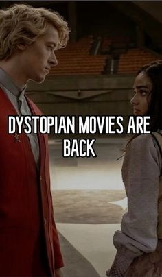 two people standing next to each other with the words dystopian movies are back